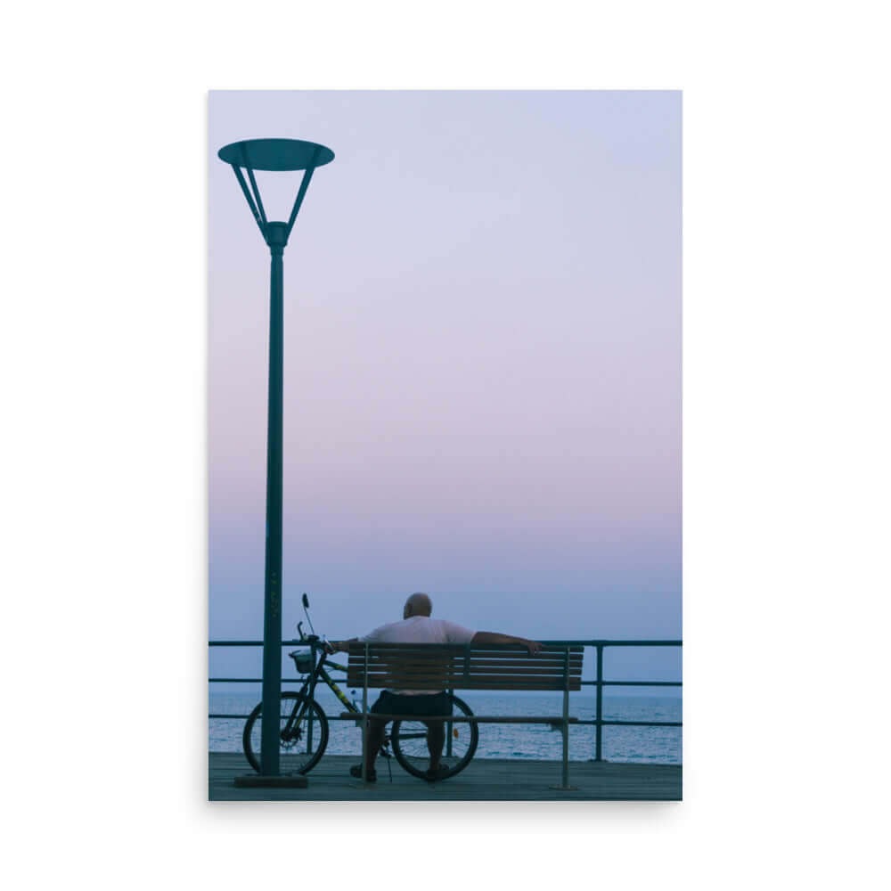 Man sitting on a bench during sunset