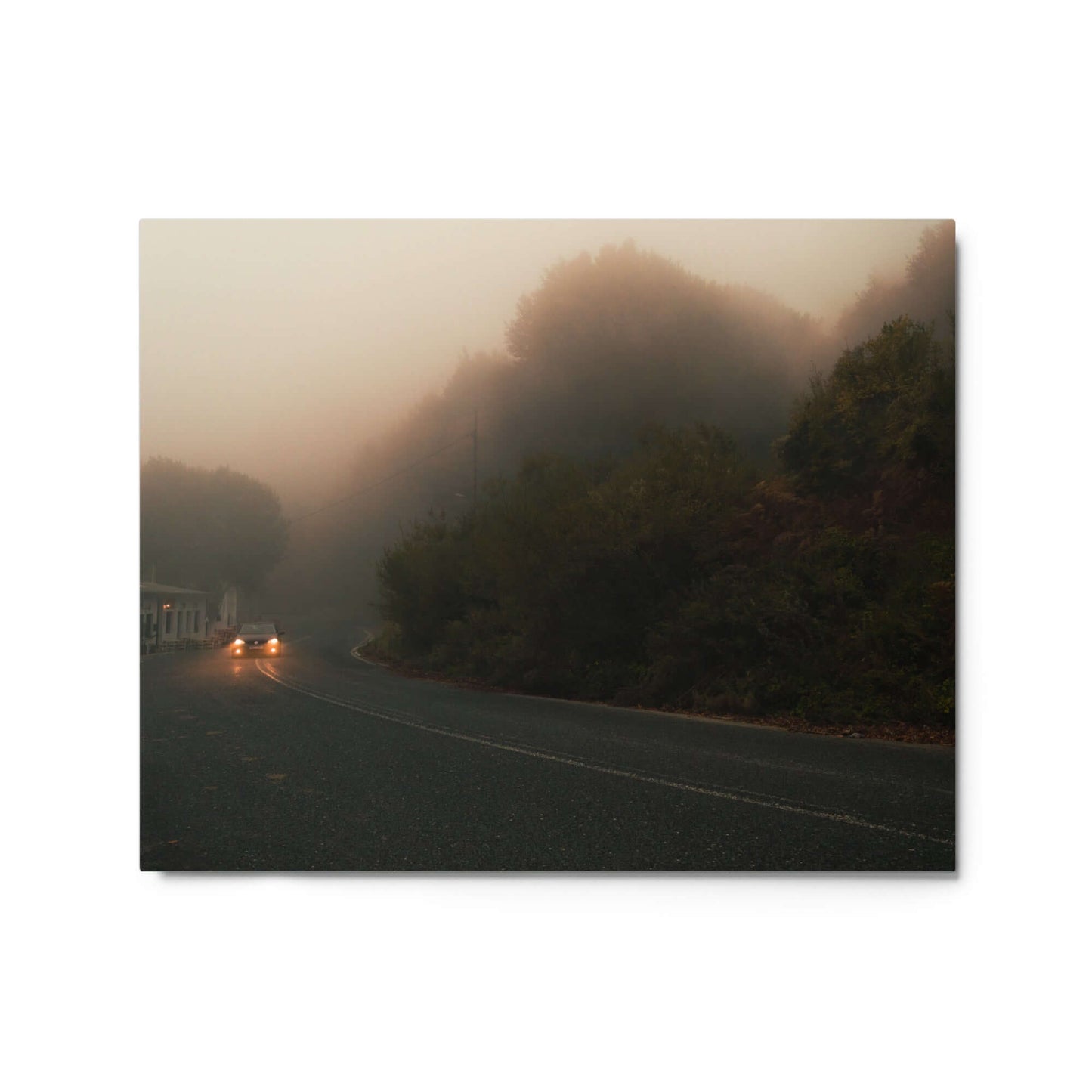 Unframed Photograph of a car driving in a foggy scenery