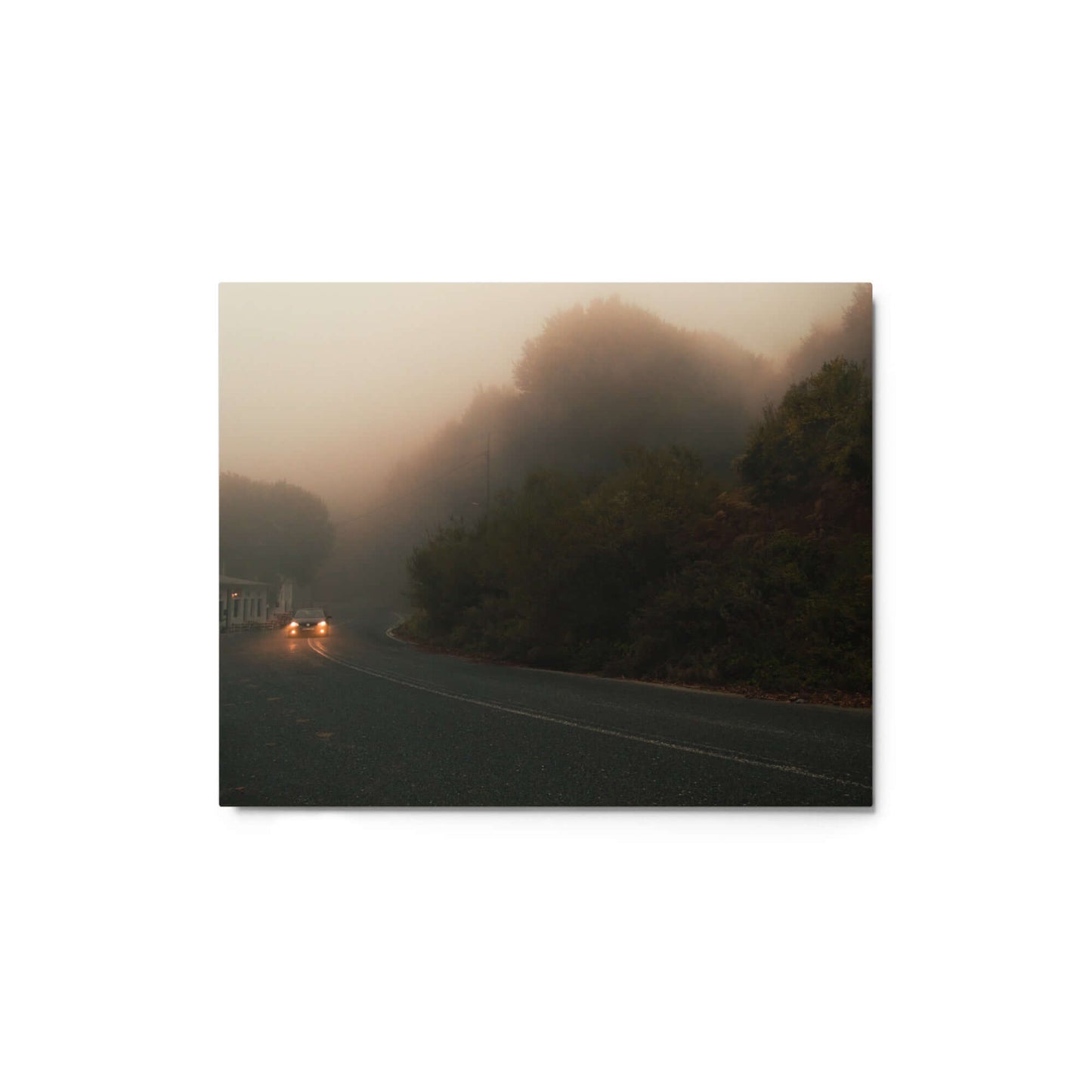 Unframed Photograph of a car driving in a foggy scenery