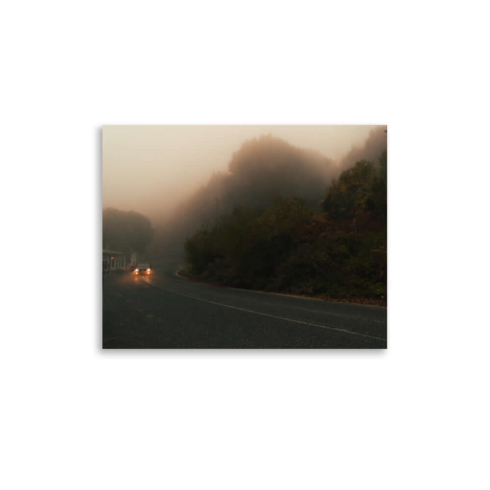 Unframed Photograph of a car driving in a foggy scenery