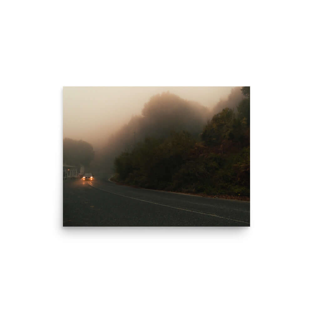 Unframed Photograph of a car driving in a foggy scenery