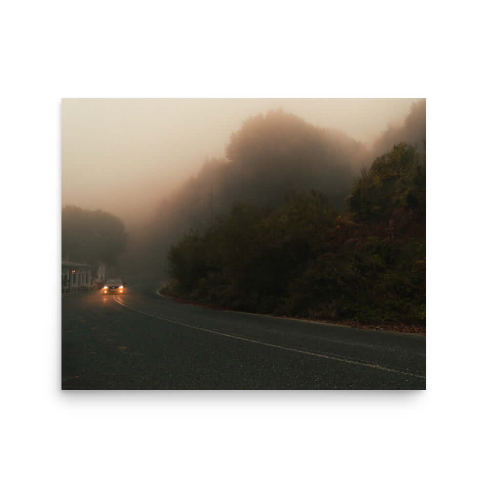 Unframed Photograph of a car driving in a foggy scenery