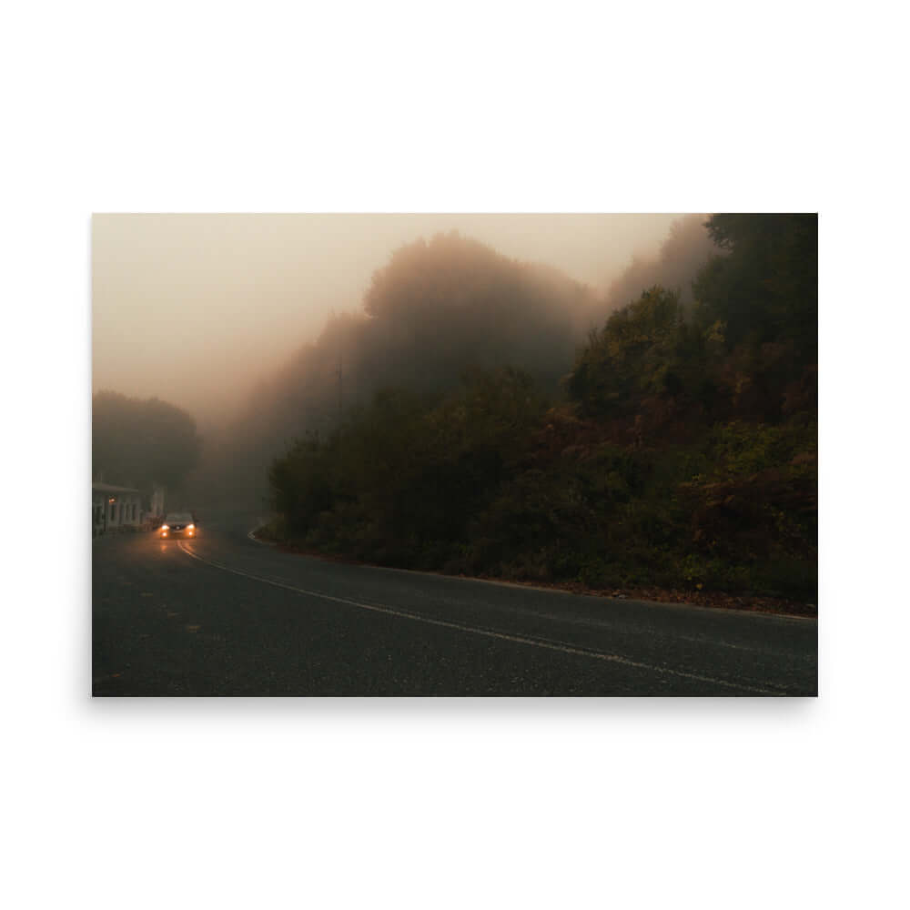 Unframed Photograph of a car driving in a foggy scenery